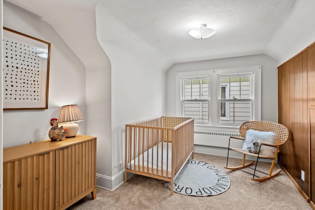 851 Watson Ave, Saint Paul, MN 55102 - carpeted bedroom featuring lofted ceiling and a crib