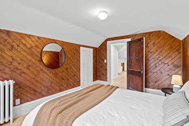 851 Watson Ave, Saint Paul, MN 55102 - bedroom featuring radiator, light carpet, wooden walls, and vaulted ceiling