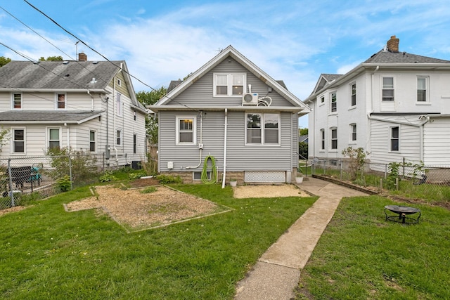 851 Watson Ave, Saint Paul, MN 55102 - back of property with an outdoor fire pit and a vegetable garden