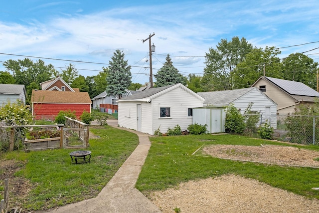 851 Watson Ave, Saint Paul, MN 55102 - view of yard with a fire pit and an outbuilding