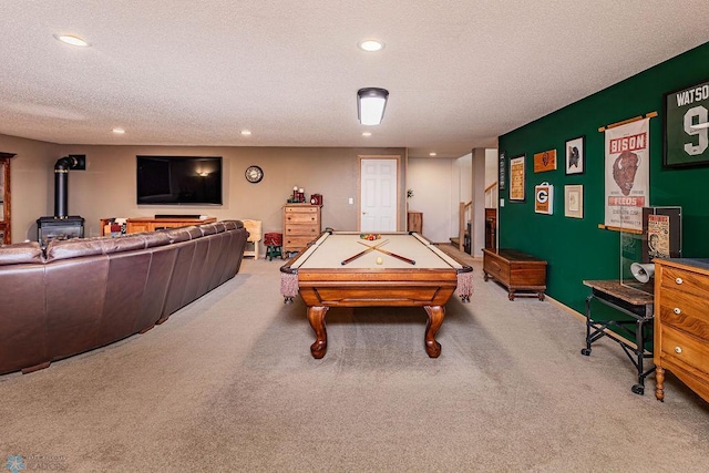 rec room featuring carpet, a wood stove, recessed lighting, pool table, and a textured ceiling