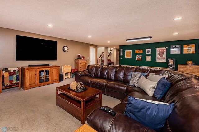 carpeted living room with recessed lighting, stairway, and a textured ceiling