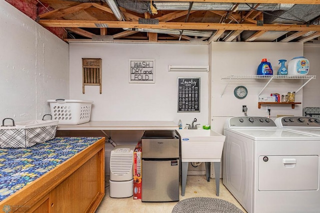 laundry area featuring separate washer and dryer and laundry area