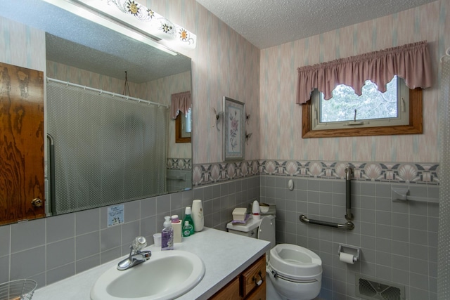 17639 Gayle Dr, Little Falls, MN 56345 - bathroom featuring vanity, wainscoting, toilet, wallpapered walls, and a shower with curtain
