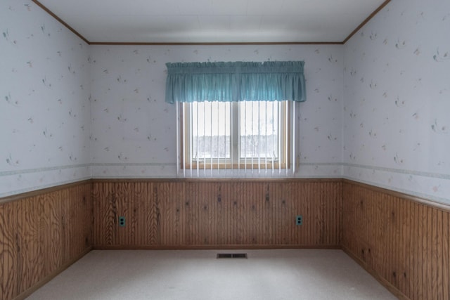 17639 Gayle Dr, Little Falls, MN 56345 - empty room featuring visible vents, wainscoting, crown molding, and wallpapered walls