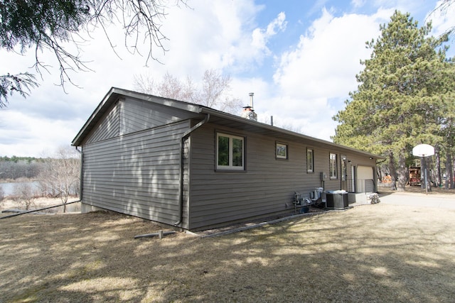 17639 Gayle Dr, Little Falls, MN 56345 - view of side of property featuring a garage and cooling unit