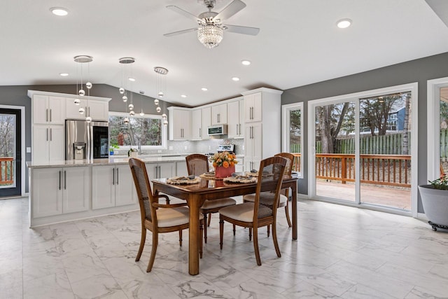 dining space with a ceiling fan, marble finish floor, lofted ceiling, and recessed lighting