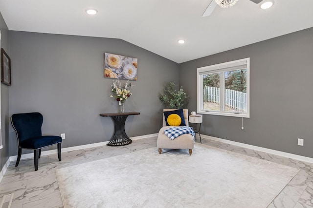 living area with marble finish floor, baseboards, lofted ceiling, and ceiling fan
