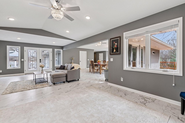 unfurnished living room featuring baseboards, marble finish floor, ceiling fan, and vaulted ceiling