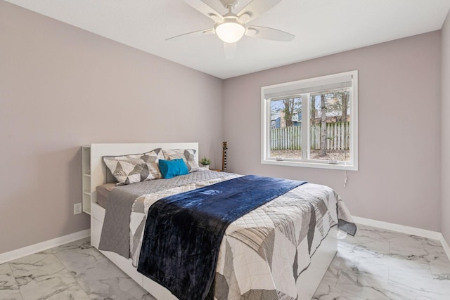 bedroom with marble finish floor, baseboards, and ceiling fan