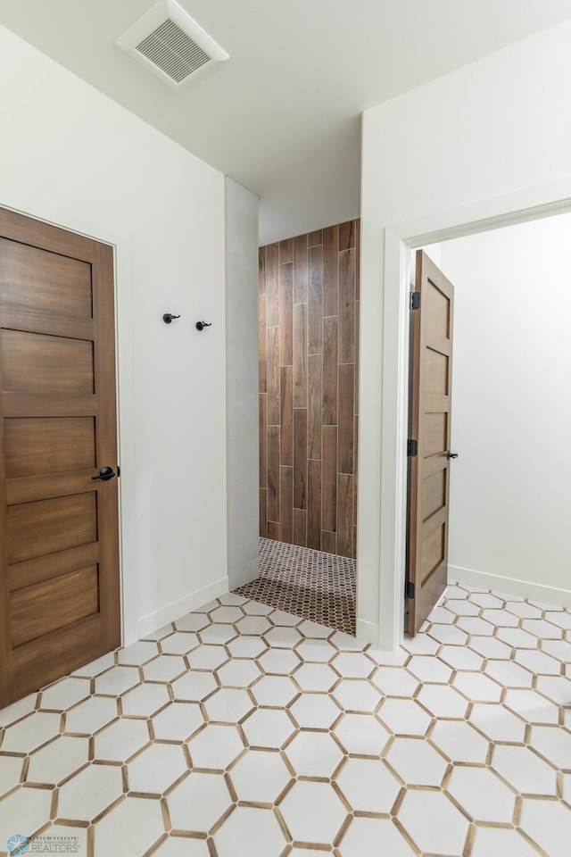 662 Rania Way W, West Fargo, ND 58078 - bathroom with a tile shower and tile patterned floors