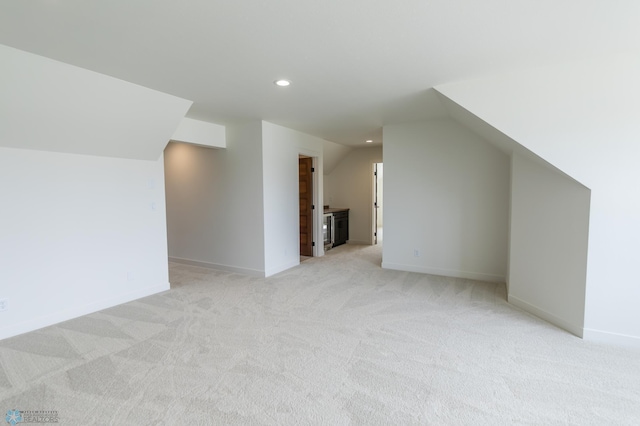 662 Rania Way W, West Fargo, ND 58078 - additional living space with light colored carpet, recessed lighting, and lofted ceiling
