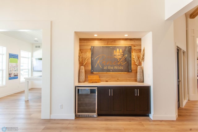 662 Rania Way W, West Fargo, ND 58078 - indoor dry bar with wine cooler, light wood-style floors, and recessed lighting