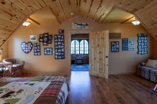 bedroom with baseboards, wood ceiling, lofted ceiling, and wood finished floors