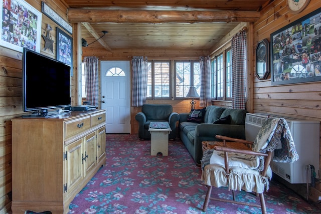 sunroom / solarium featuring heating unit and beamed ceiling