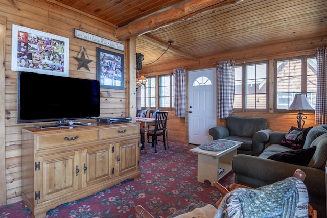 carpeted living room with wooden ceiling, beamed ceiling, and wood walls