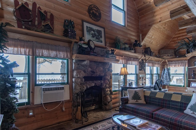 living room featuring a towering ceiling, rustic walls, cooling unit, and a fireplace