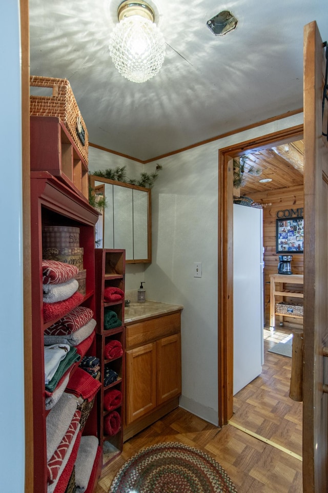21594 452nd Pl, Aitkin, MN 56431 - bathroom featuring vanity and ornamental molding