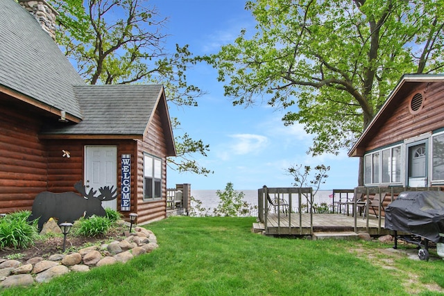 21594 452nd Pl, Aitkin, MN 56431 - view of grassy yard with a deck with water view and entry steps
