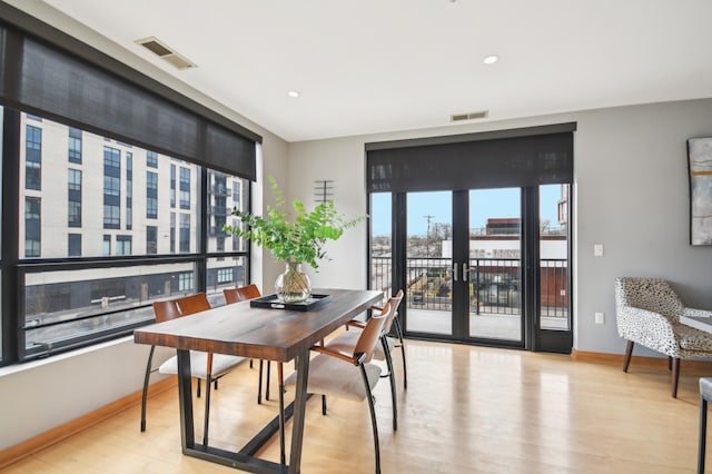 3104 Lake St Unit 202, Minneapolis, MN 55416 - dining space with light wood finished floors, baseboards, and recessed lighting