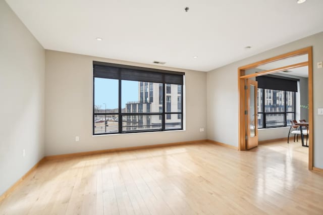 3104 Lake St Unit 202, Minneapolis, MN 55416 - empty room featuring baseboards, light wood-style floors, and recessed lighting