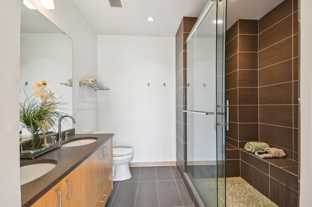 3104 Lake St Unit 202, Minneapolis, MN 55416 - full bathroom featuring a stall shower, toilet, tile patterned flooring, double vanity, and recessed lighting