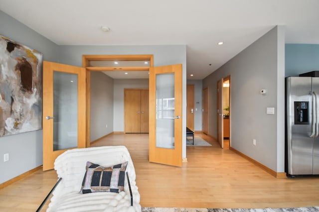 3104 Lake St Unit 202, Minneapolis, MN 55416 - bedroom featuring stainless steel fridge with ice dispenser, light wood-style floors, french doors, baseboards, and recessed lighting
