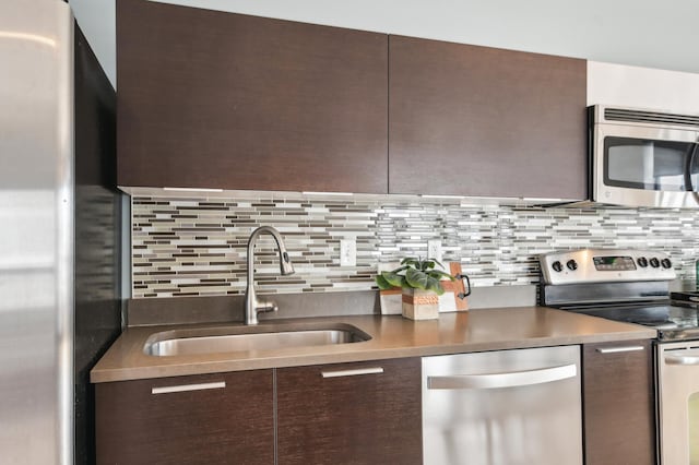 3104 Lake St Unit 202, Minneapolis, MN 55416 - kitchen featuring stainless steel appliances, modern cabinets, and dark brown cabinets