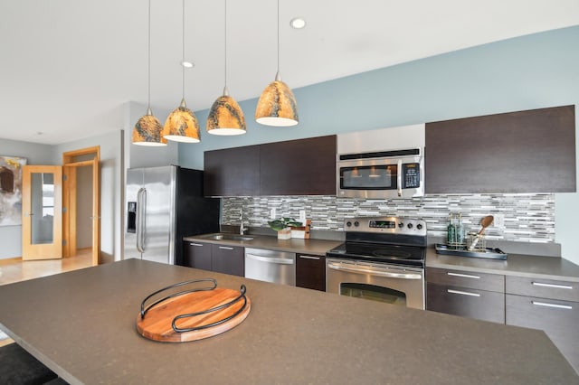 3104 Lake St Unit 202, Minneapolis, MN 55416 - kitchen with appliances with stainless steel finishes, modern cabinets, dark countertops, and tasteful backsplash
