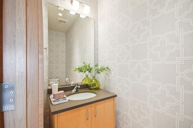3104 Lake St Unit 202, Minneapolis, MN 55416 - bathroom featuring vanity and wallpapered walls