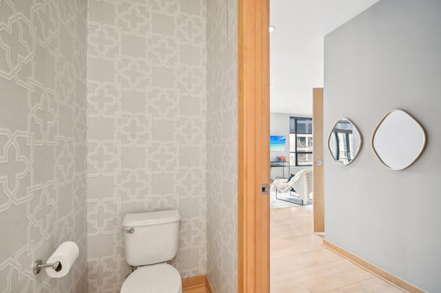 3104 Lake St Unit 202, Minneapolis, MN 55416 - bathroom with toilet, wood finished floors, and baseboards