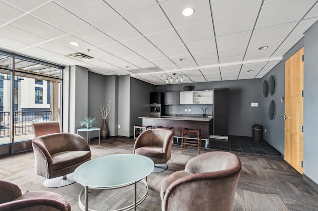 3104 Lake St Unit 202, Minneapolis, MN 55416 - community lobby featuring a drop ceiling and floor to ceiling windows
