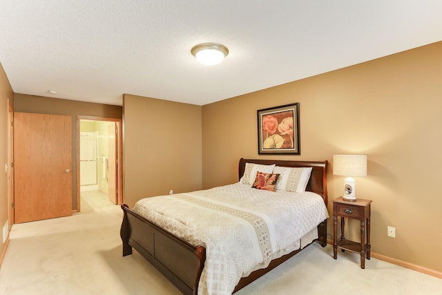 bedroom with light carpet and baseboards