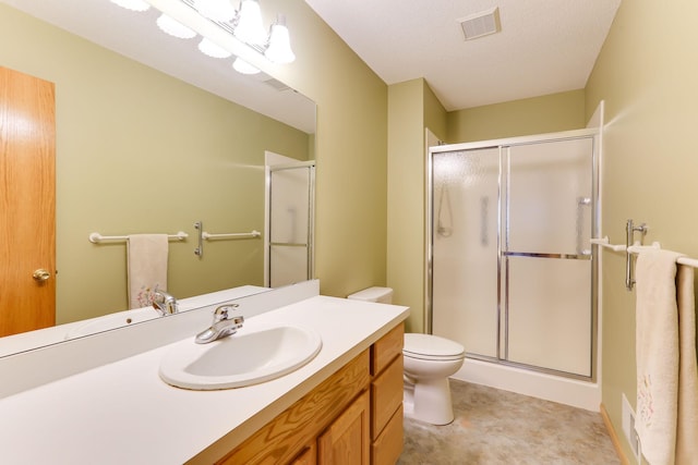 full bath with a stall shower, toilet, and vanity