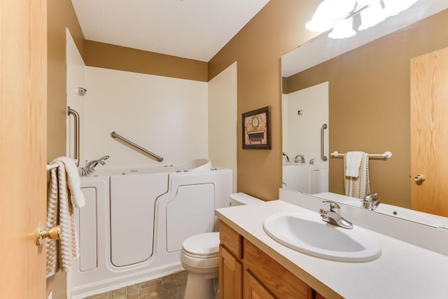 full bath featuring a bath, toilet, and vanity