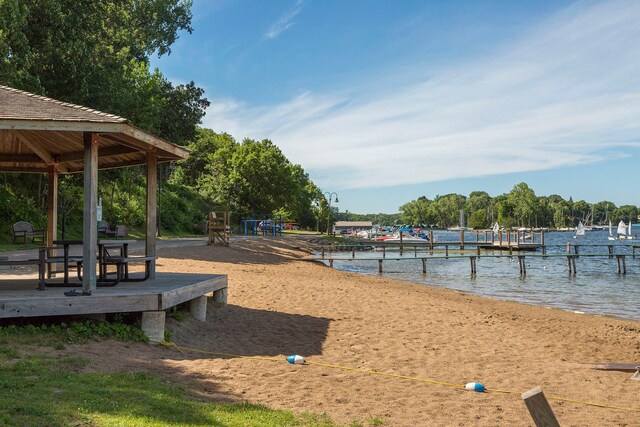 18975 Highland Ave, Deephaven, MN 55391 - view of property's community with a gazebo, a water view, and a boat dock