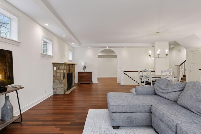 18975 Highland Ave, Deephaven, MN 55391 - living area featuring a fireplace, wood finished floors, arched walkways, recessed lighting, and a chandelier