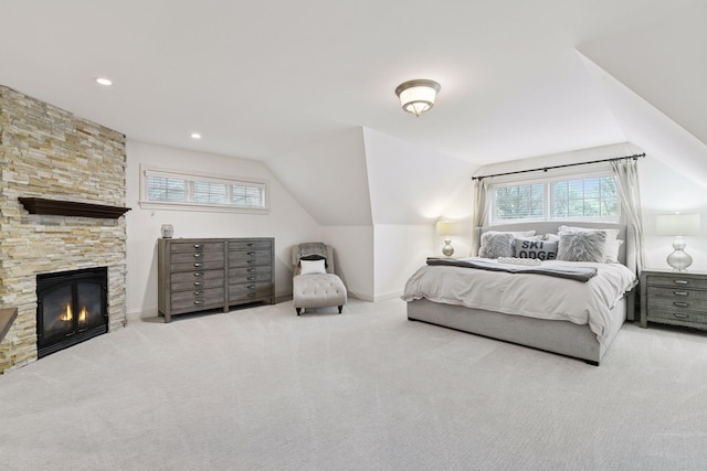 18975 Highland Ave, Deephaven, MN 55391 - carpeted bedroom featuring lofted ceiling, baseboards, and a stone fireplace