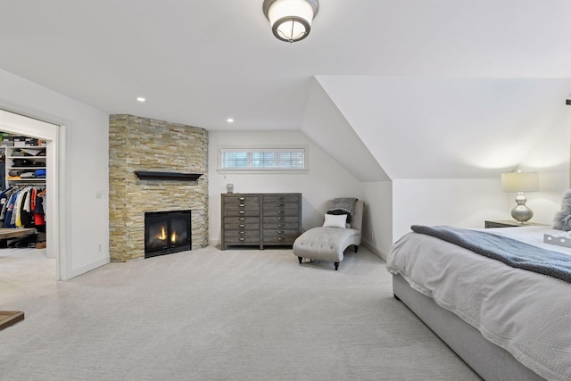 18975 Highland Ave, Deephaven, MN 55391 - carpeted bedroom featuring a spacious closet, baseboards, a closet, and a stone fireplace