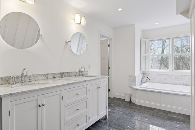 18975 Highland Ave, Deephaven, MN 55391 - full bathroom with double vanity, baseboards, a bath, and recessed lighting