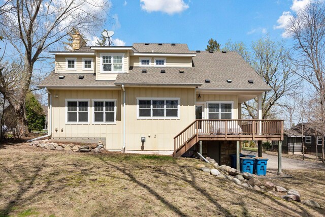 18975 Highland Ave, Deephaven, MN 55391 - back of house with a wooden deck, a chimney, stairway, a shingled roof, and board and batten siding