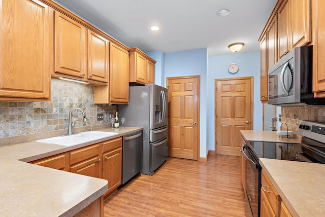 11102 16th St NE, Saint Michael, MN 55376 - kitchen featuring stainless steel appliances, tasteful backsplash, light wood-type flooring, light countertops, and recessed lighting