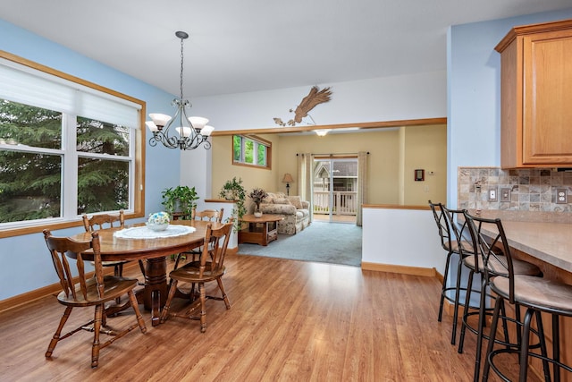 11102 16th St NE, Saint Michael, MN 55376 - dining area with light wood finished floors and a chandelier