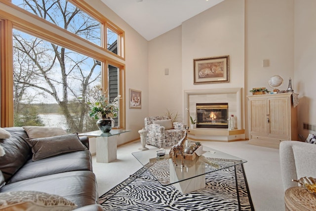 780 Virginia Shores Cir, Excelsior, MN 55331 - carpeted living area featuring high vaulted ceiling, a tile fireplace, and a water view
