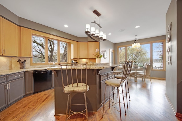 780 Virginia Shores Cir, Excelsior, MN 55331 - kitchen with dishwasher, light wood-type flooring, light stone countertops, and recessed lighting