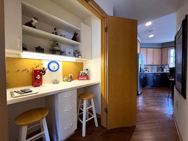 780 Virginia Shores Cir, Excelsior, MN 55331 - kitchen with stainless steel fridge, a kitchen bar, dark wood finished floors, light countertops, and recessed lighting