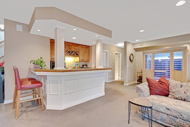 780 Virginia Shores Cir, Excelsior, MN 55331 - living room featuring bar with sink, light carpet, recessed lighting, and baseboards