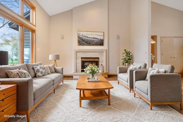 780 Virginia Shores Cir, Excelsior, MN 55331 - living area featuring high vaulted ceiling, light wood-style floors, a high end fireplace, and baseboards