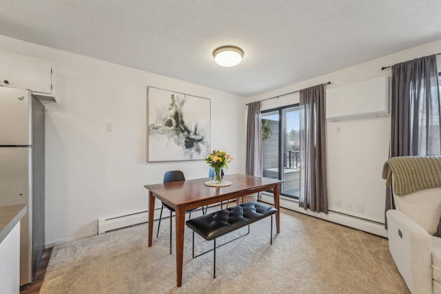 dining space with a baseboard radiator and light colored carpet