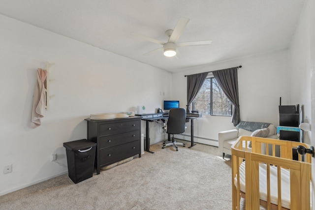 home office with a ceiling fan, baseboards, carpet floors, and baseboard heating